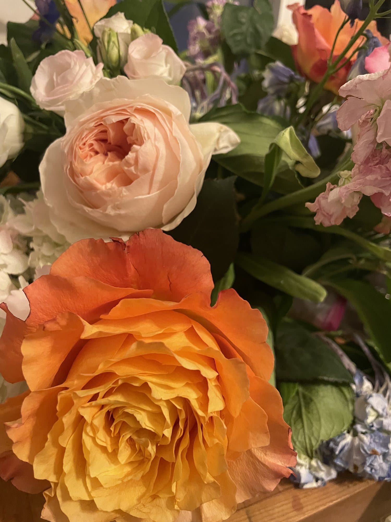 Centerpiece of peach and orange garden roses